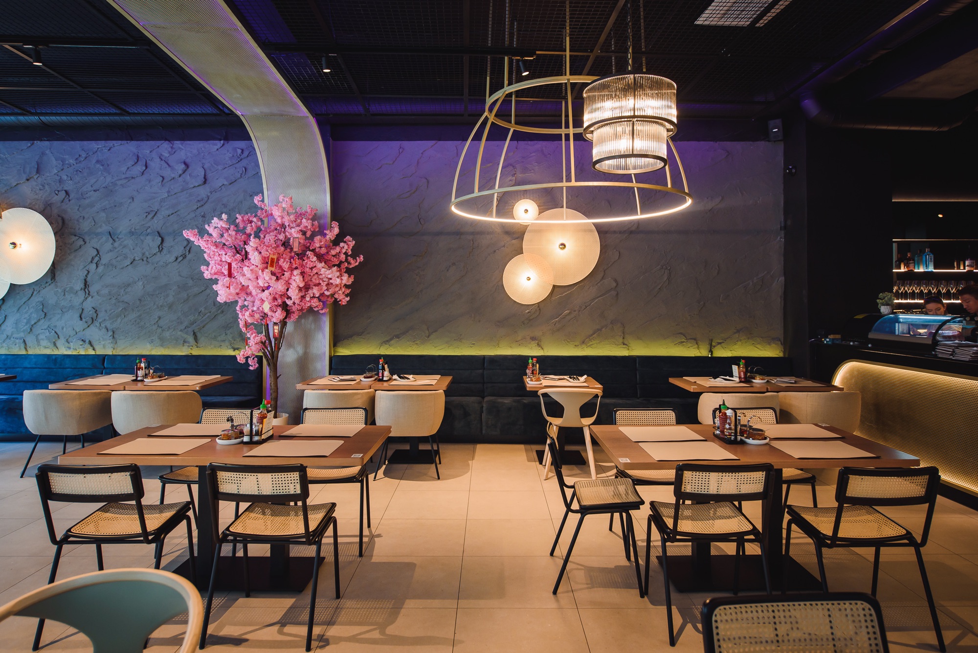Bonsai restaurant interior with cherry-blossom tree and sushi bar