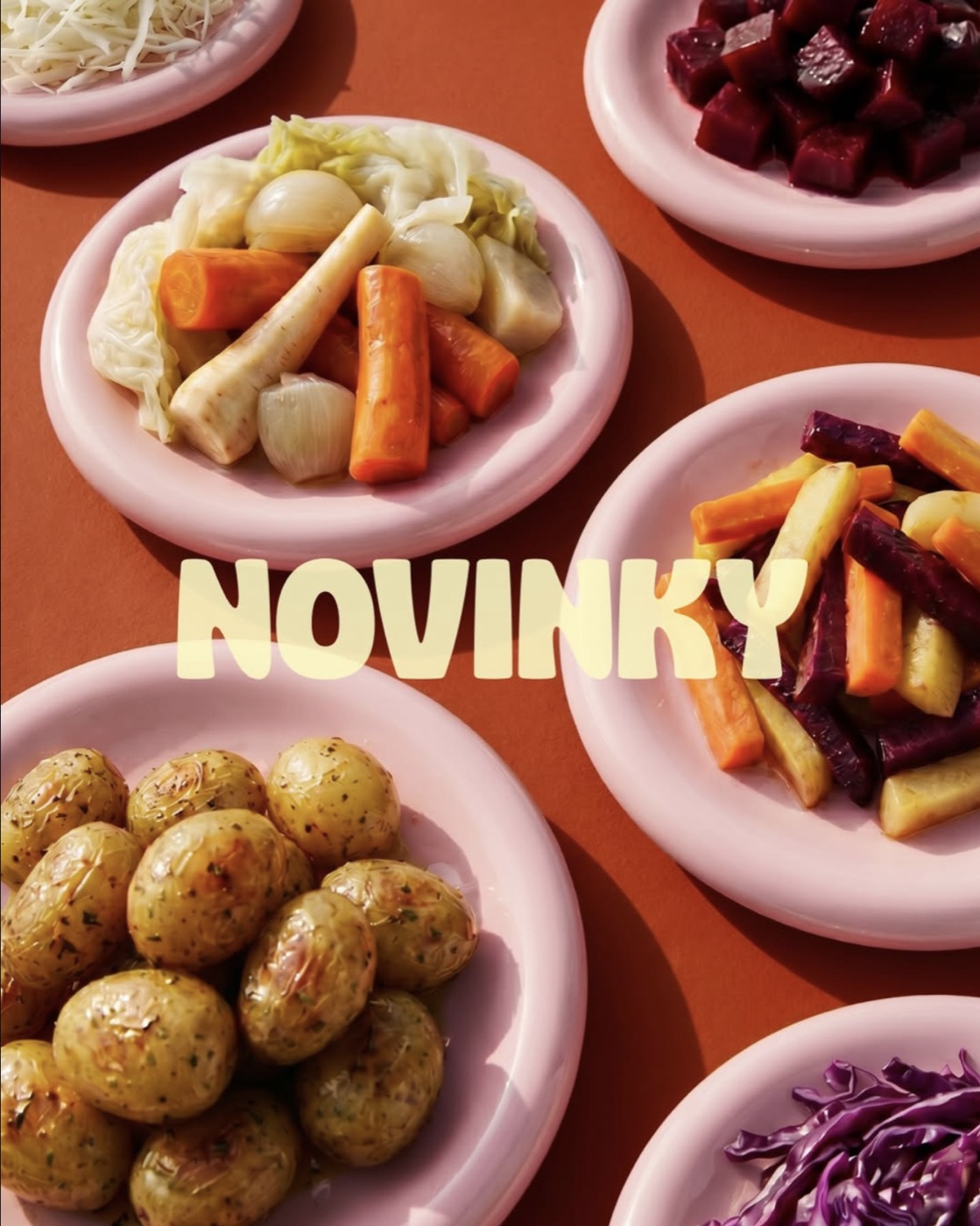 Novinky campaign visual: pink plates of vegetables and potatoes on orange