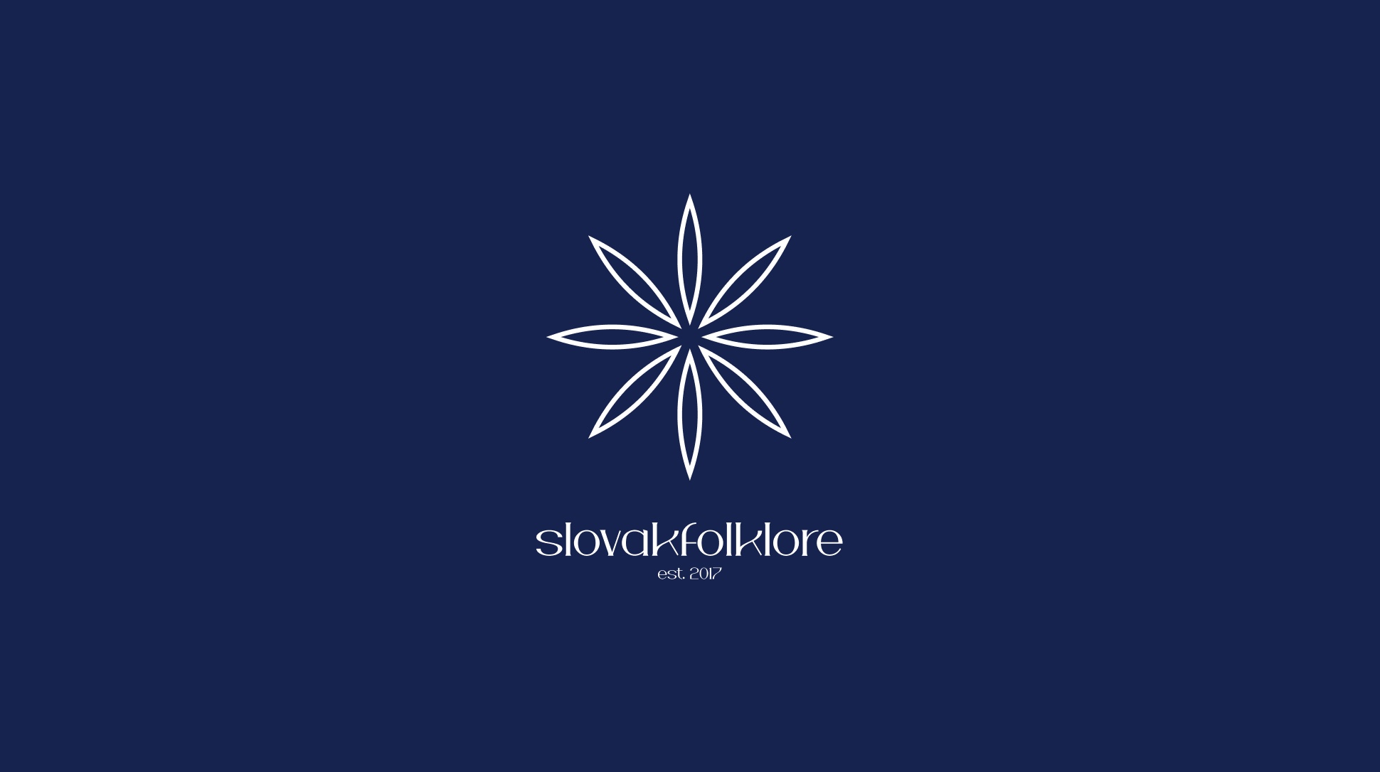 The 2026 Slovakfolklore identity: an eight-petal star drawn in white line on deep navy, above the wordmark slovakfolklore, est. 2017